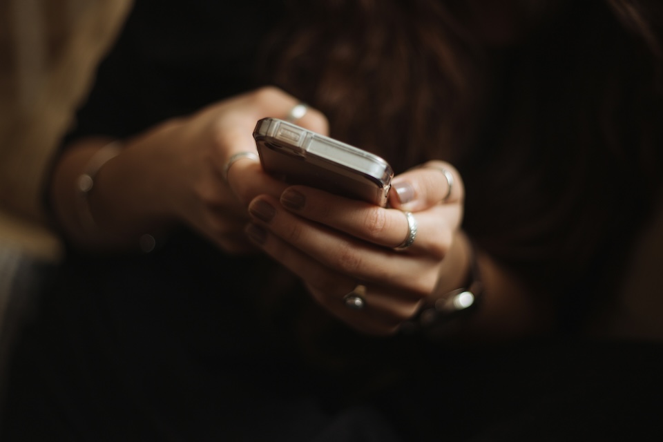 Hands holding a smart phone